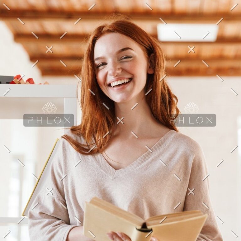 happy-redhead-young-lady-student-reading-book-M5Z7RVC@2x-1.jpg